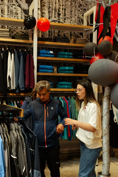Alpine Skate staff helping a customer inside the store