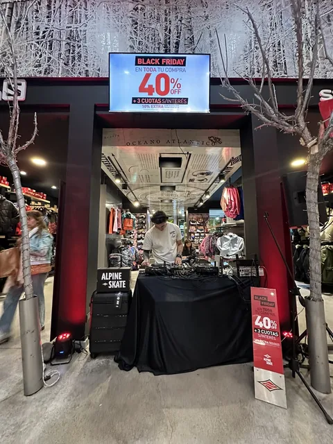 DJ booth at the store entrance, under the Black Friday screen